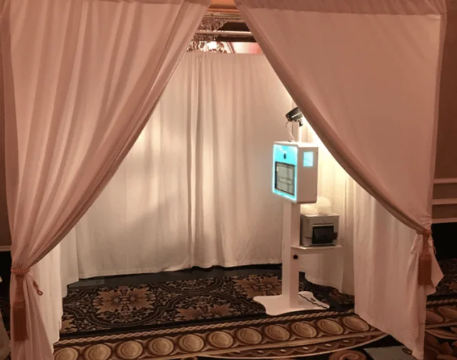 Draped cabana photo booth with a private seating area