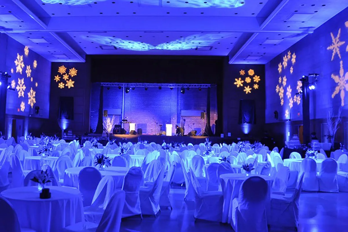 An event ballroom with coordinated blue lighting