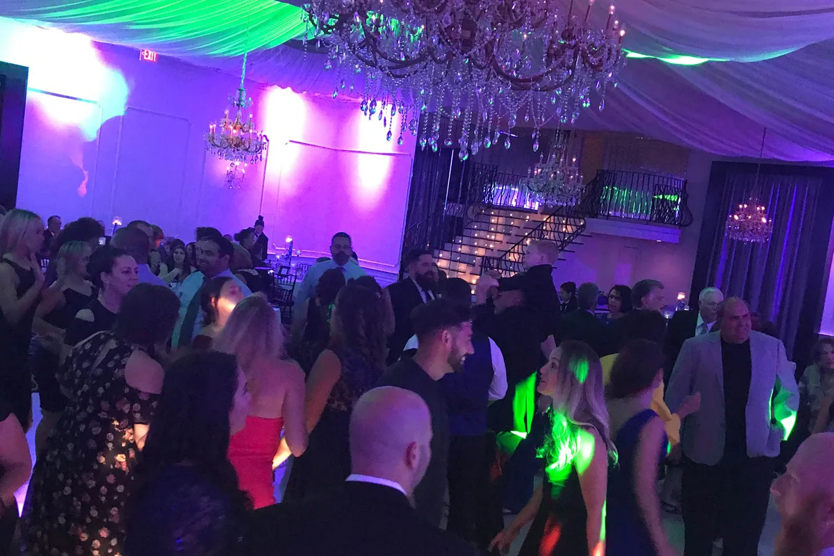 Guests gathered on an event dance floor