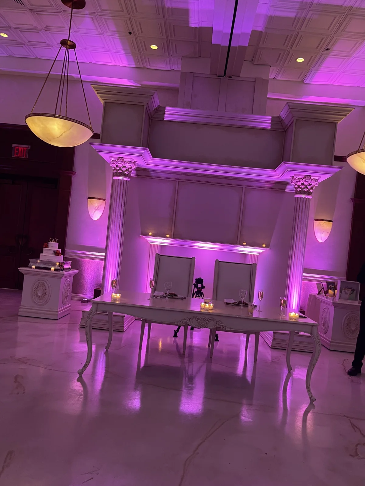 Purple uplighting around a ballroom