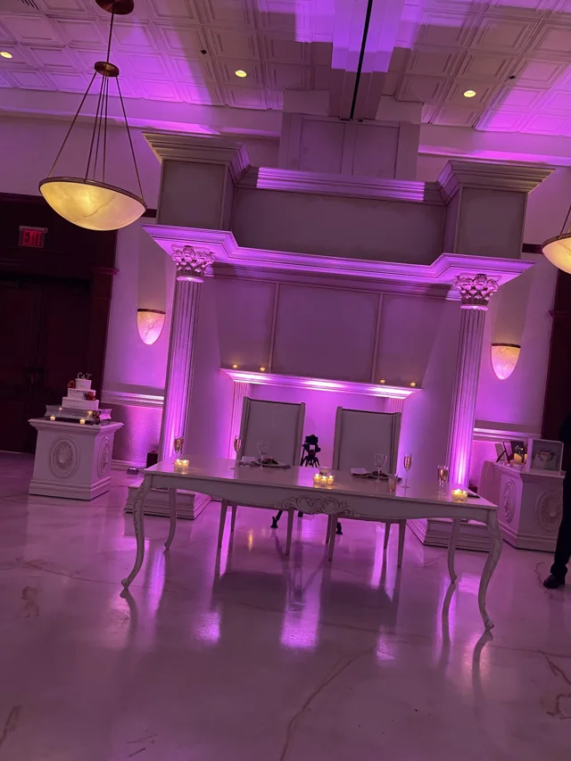 Purple uplighting around a ballroom